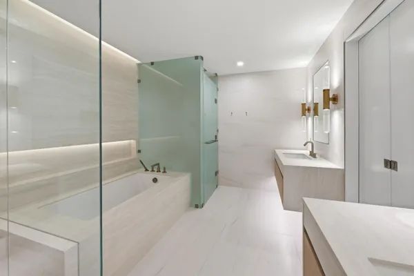 a spacious bedroom with a bed and a large window