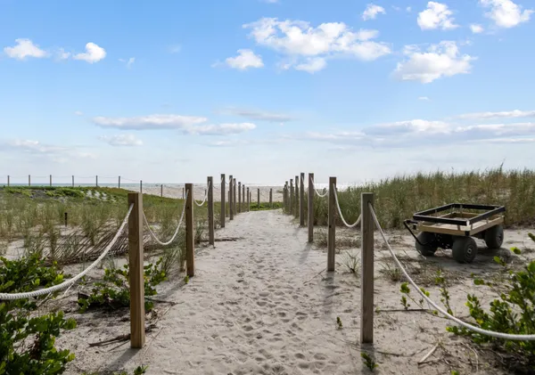 a view of a patio with a dining table and chairs