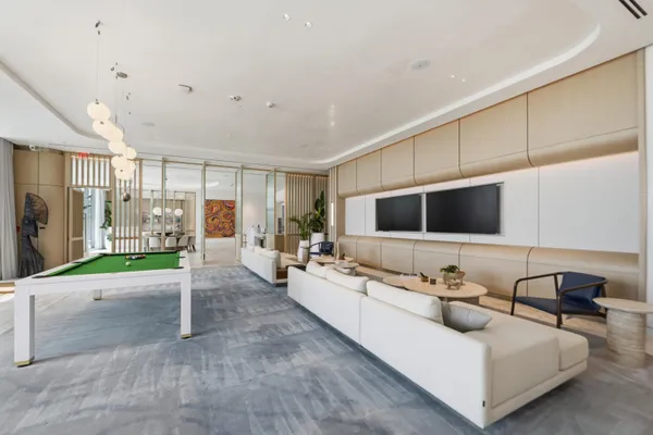 a living room with furniture or couch and a potted plant