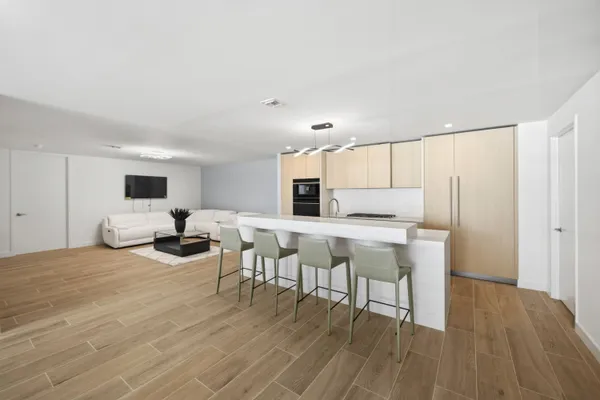 a view of a dining room with furniture and wooden floor