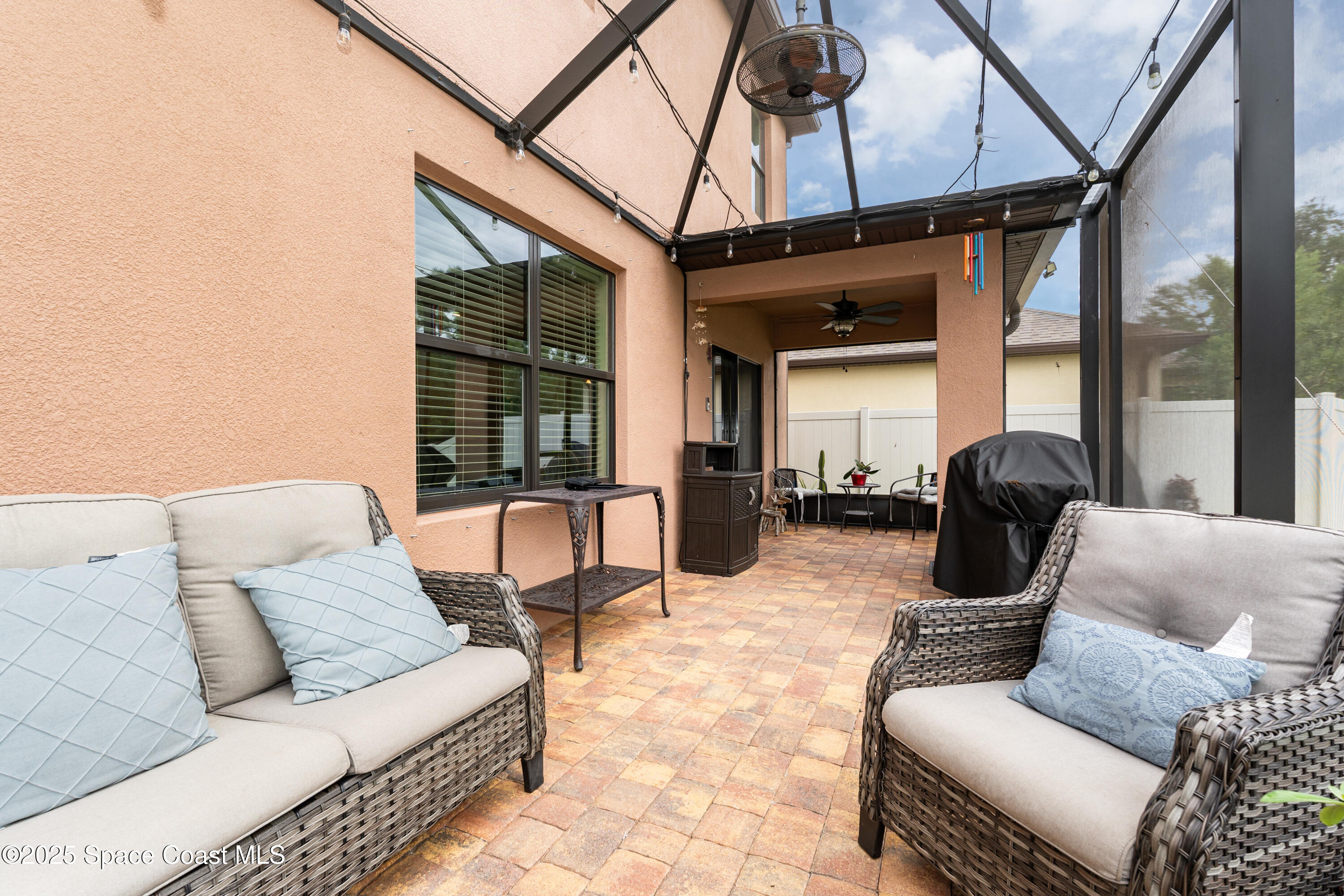 904 Old Country Rd S East Palm Bay, FL 32909 - Photo 11 of 25 a living room with furniture and a large window