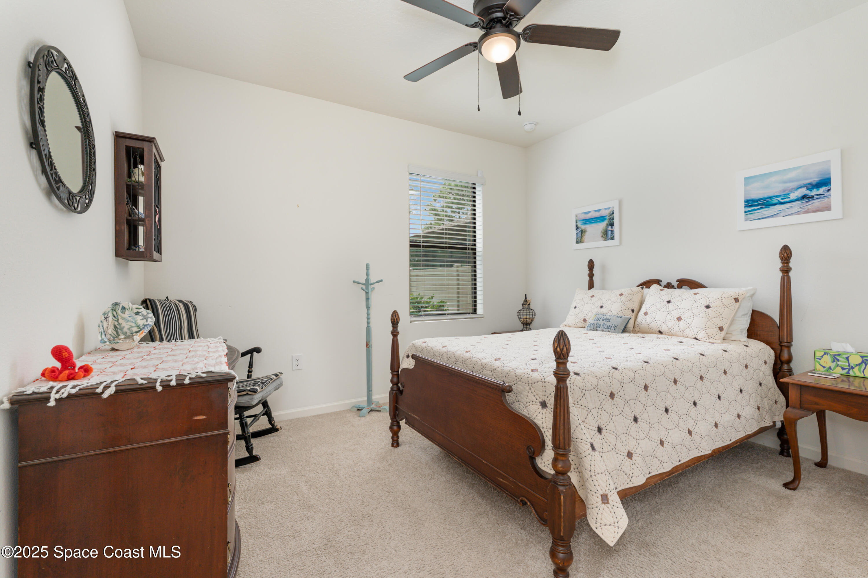 904 Old Country Rd S East Palm Bay, FL 32909 - Photo 14 of 25 a bedroom with a bed and a window