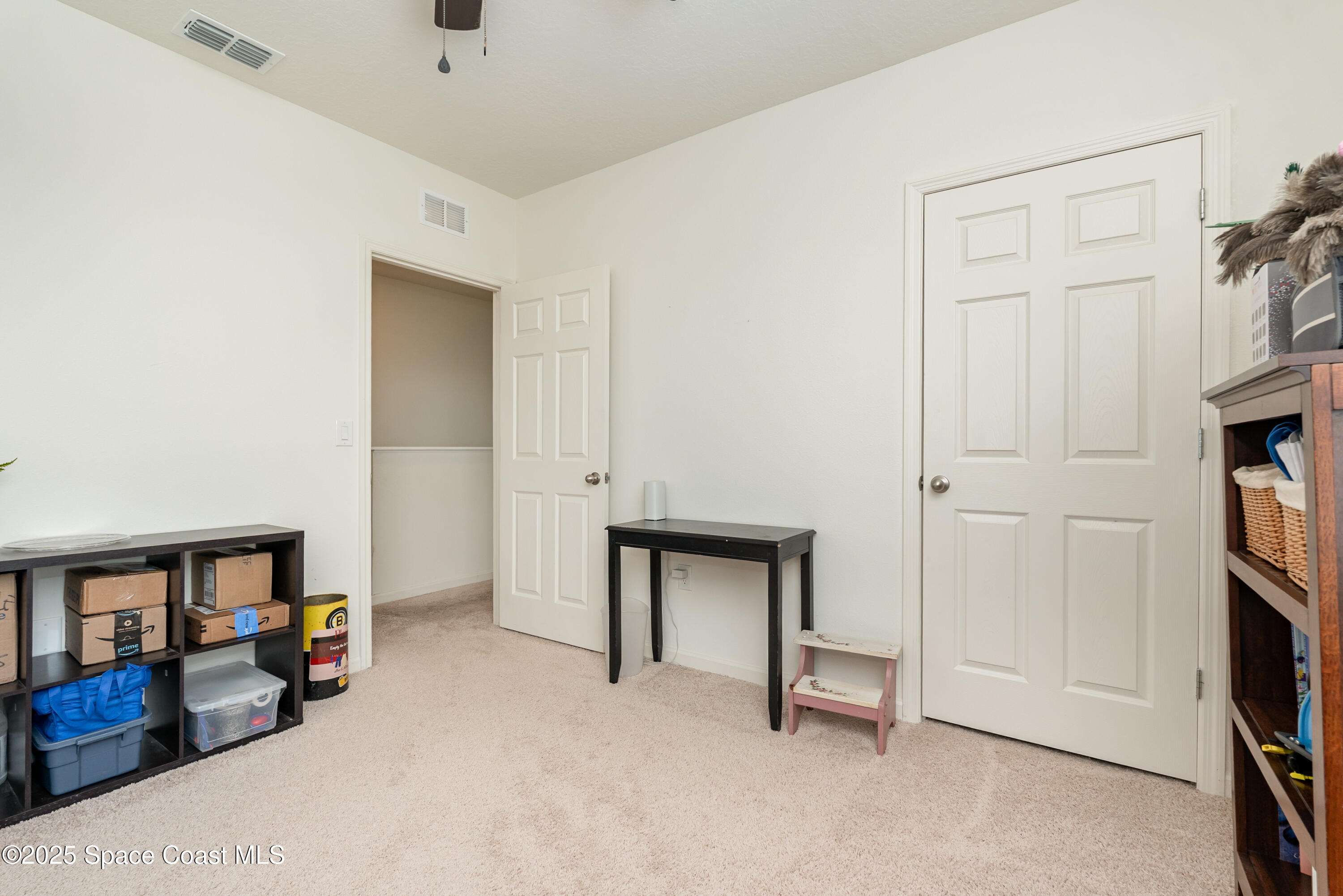 904 Old Country Rd S East Palm Bay, FL 32909 - Photo 17 of 25 a view of an empty room with window and a kitchen