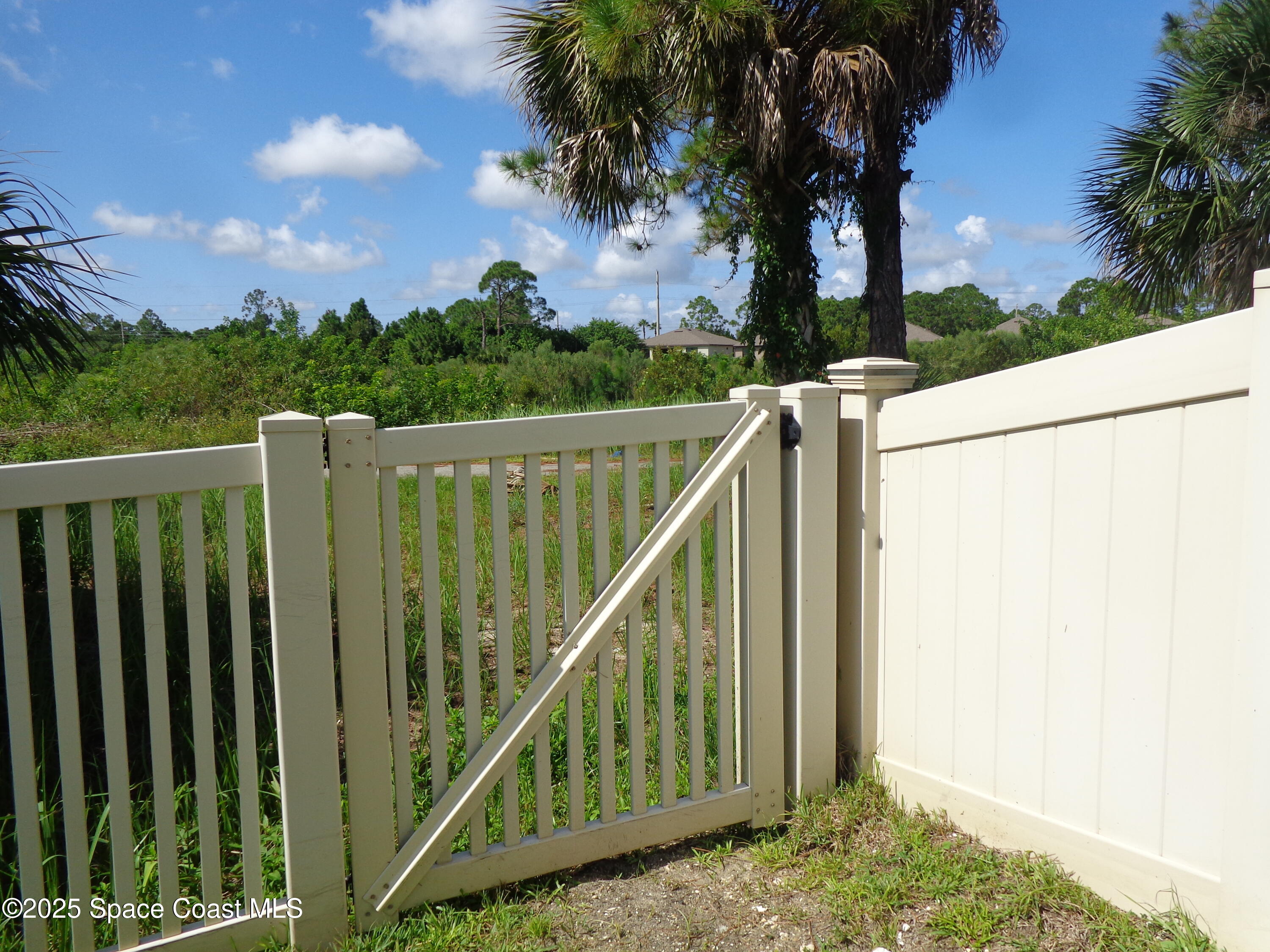 904 Old Country Rd S East Palm Bay, FL 32909 - Photo 4 of 25 a view of balcony with wooden floor and fence