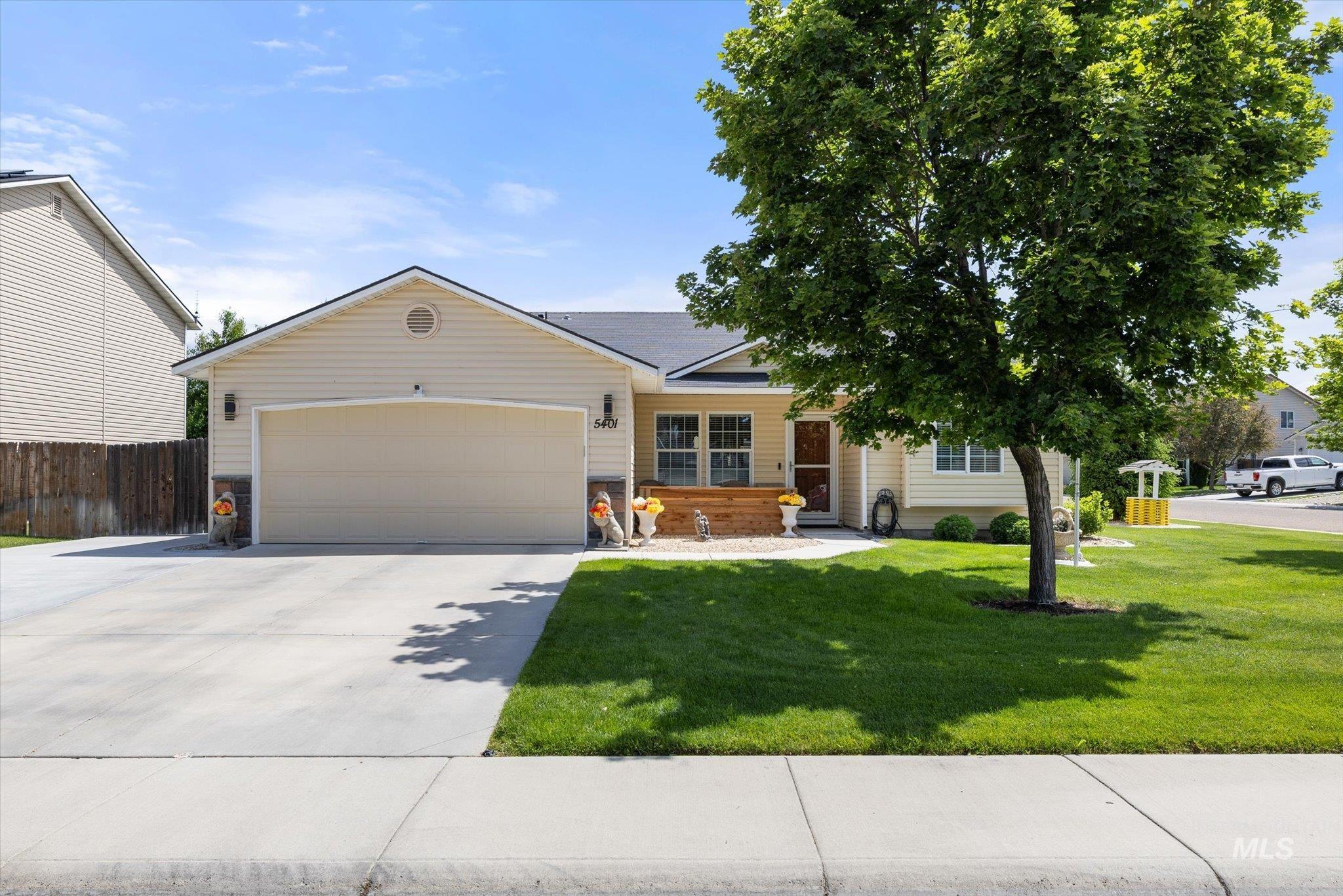 5401 Barkley Way Caldwell, ID 83607 - Photo 1 of 35 Single-story residence featuring light-colored siding and a dark shingle roof