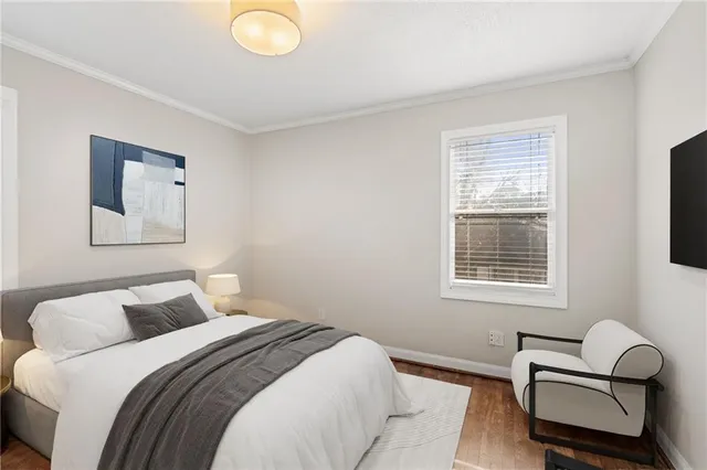 a bedroom with bed and a window