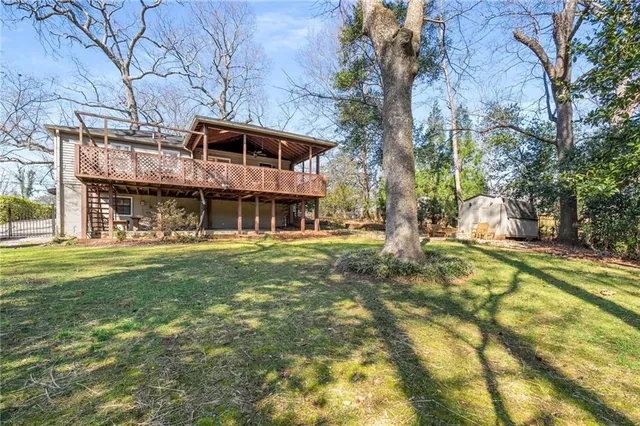 a view of house with a yard