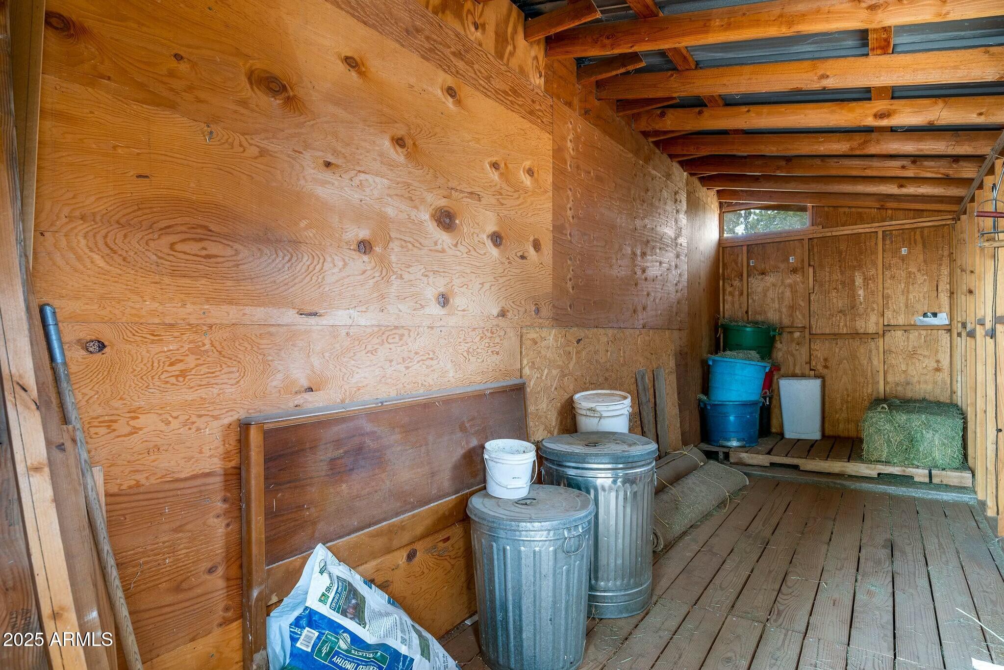 2061 Cherokee Strip Road Overgaard, AZ 85933 - Photo 23 of 40 a view of a bathroom with a sink and wooden floor