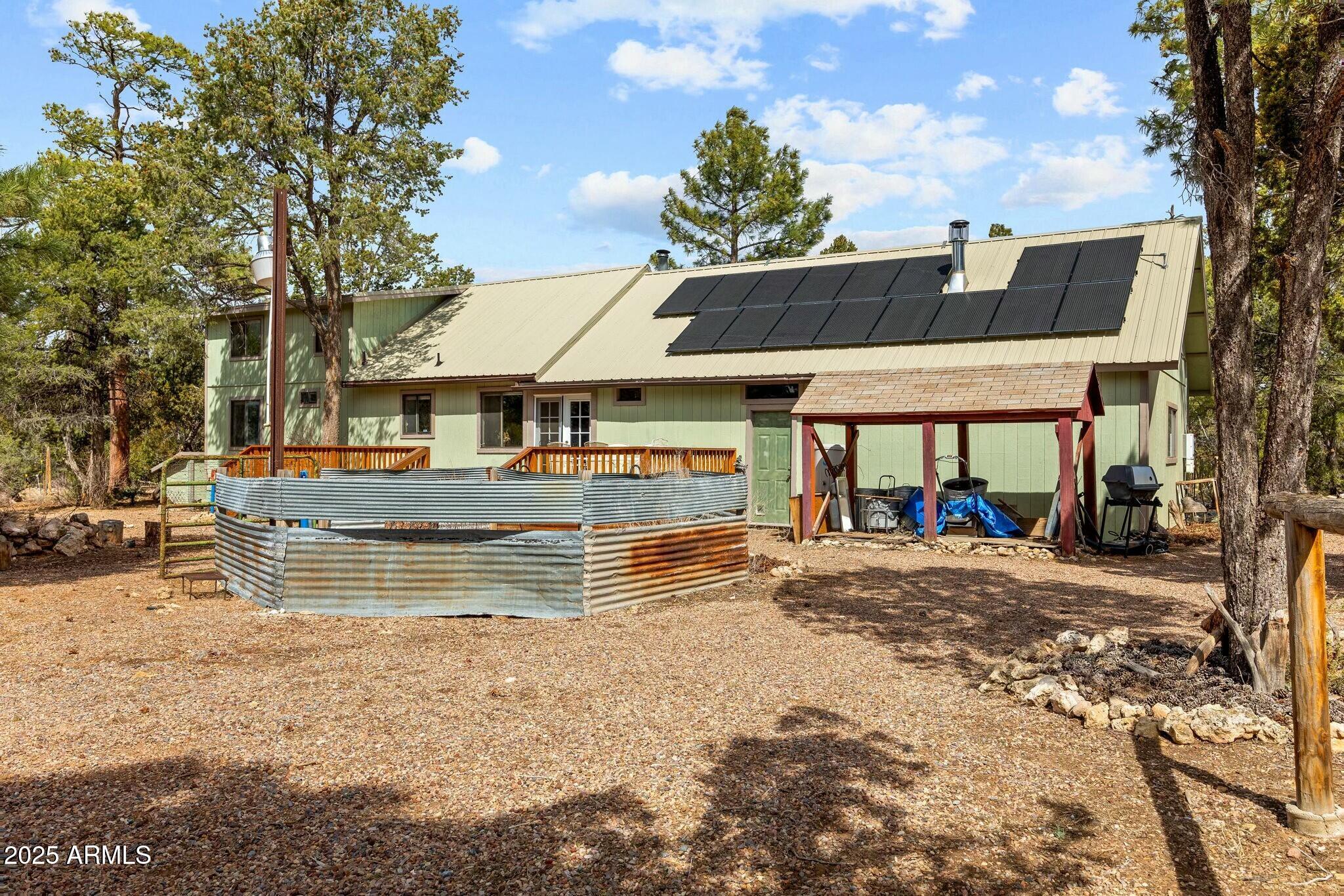 2061 Cherokee Strip Road Overgaard, AZ 85933 - Photo 29 of 40 a view of a house with a patio
