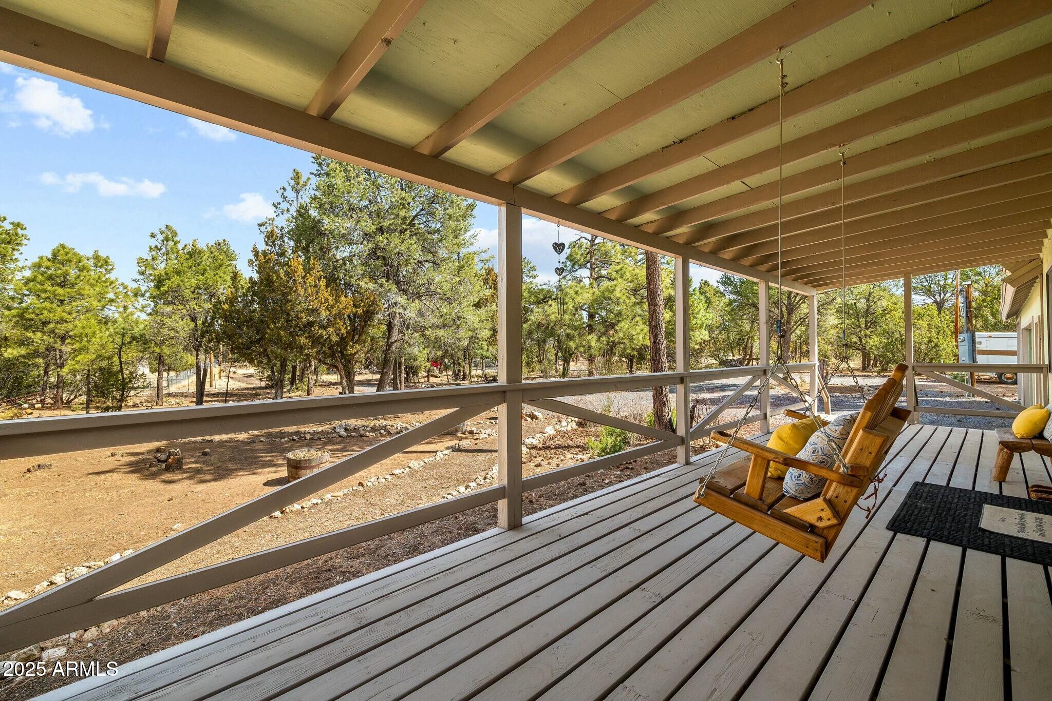2061 Cherokee Strip Road Overgaard, AZ 85933 - Photo 33 of 40 a view of a balcony with wooden floor