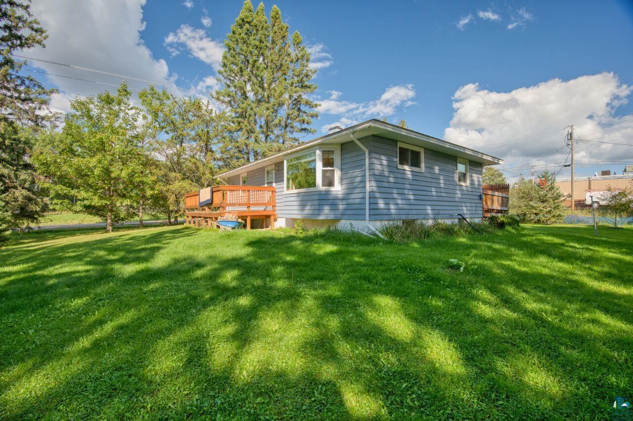 5316 Highway 110 Aurora, MN 55705 - Photo 23 of 35 View of home's exterior with a deck and a lawn