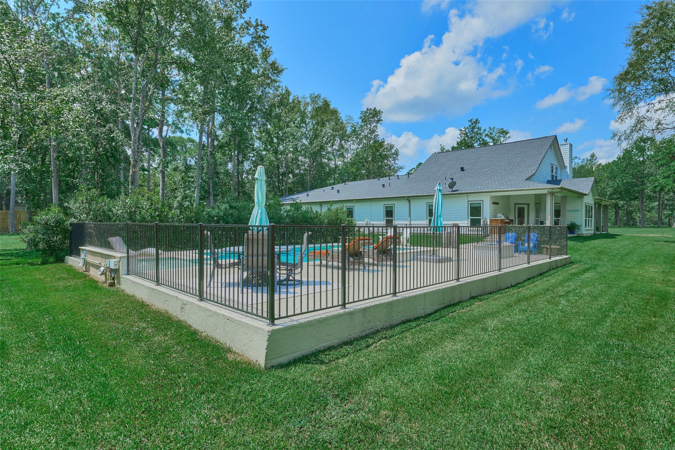 2218 Honea Egypt Road Magnolia, TX 77354 - Photo 10 of 50 Enjoy serenity and safety in this private, fenced-in pool oasis.