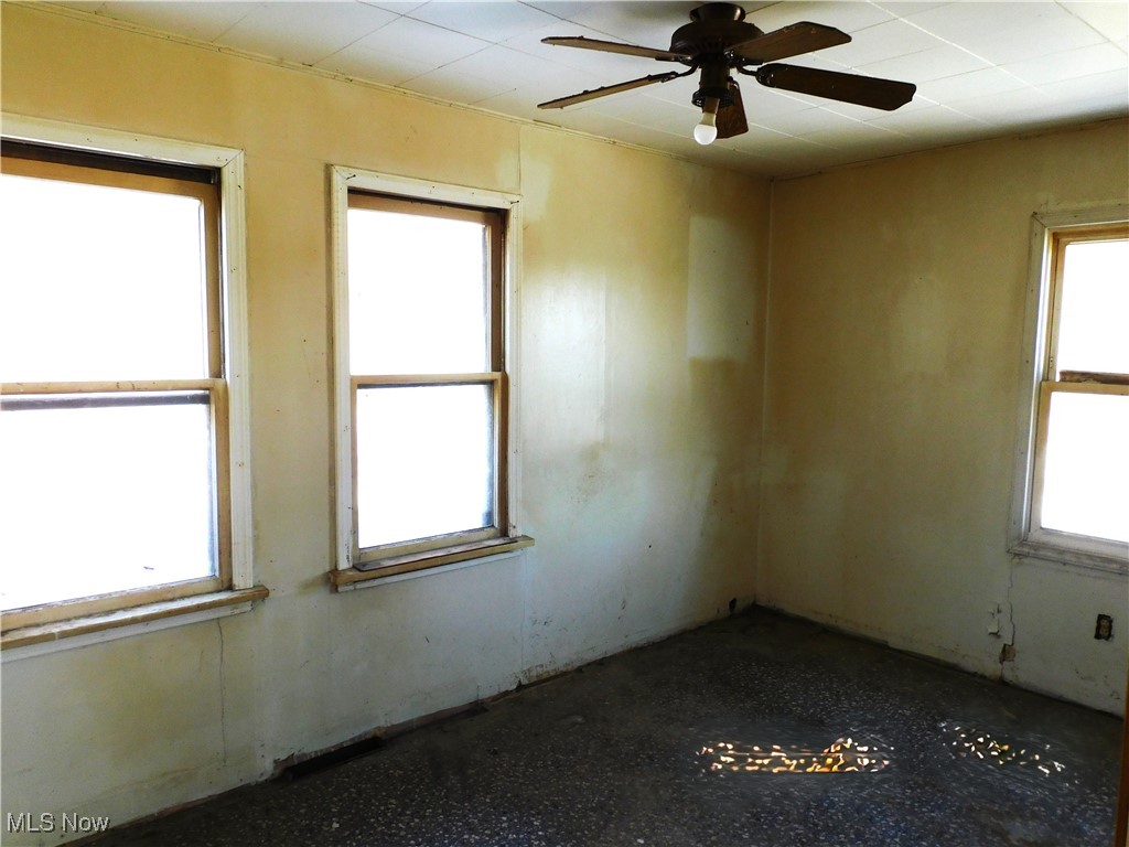 352 South Ridge Road East Conneaut, OH 44030 - Photo 14 of 21 Empty room featuring a ceiling fan