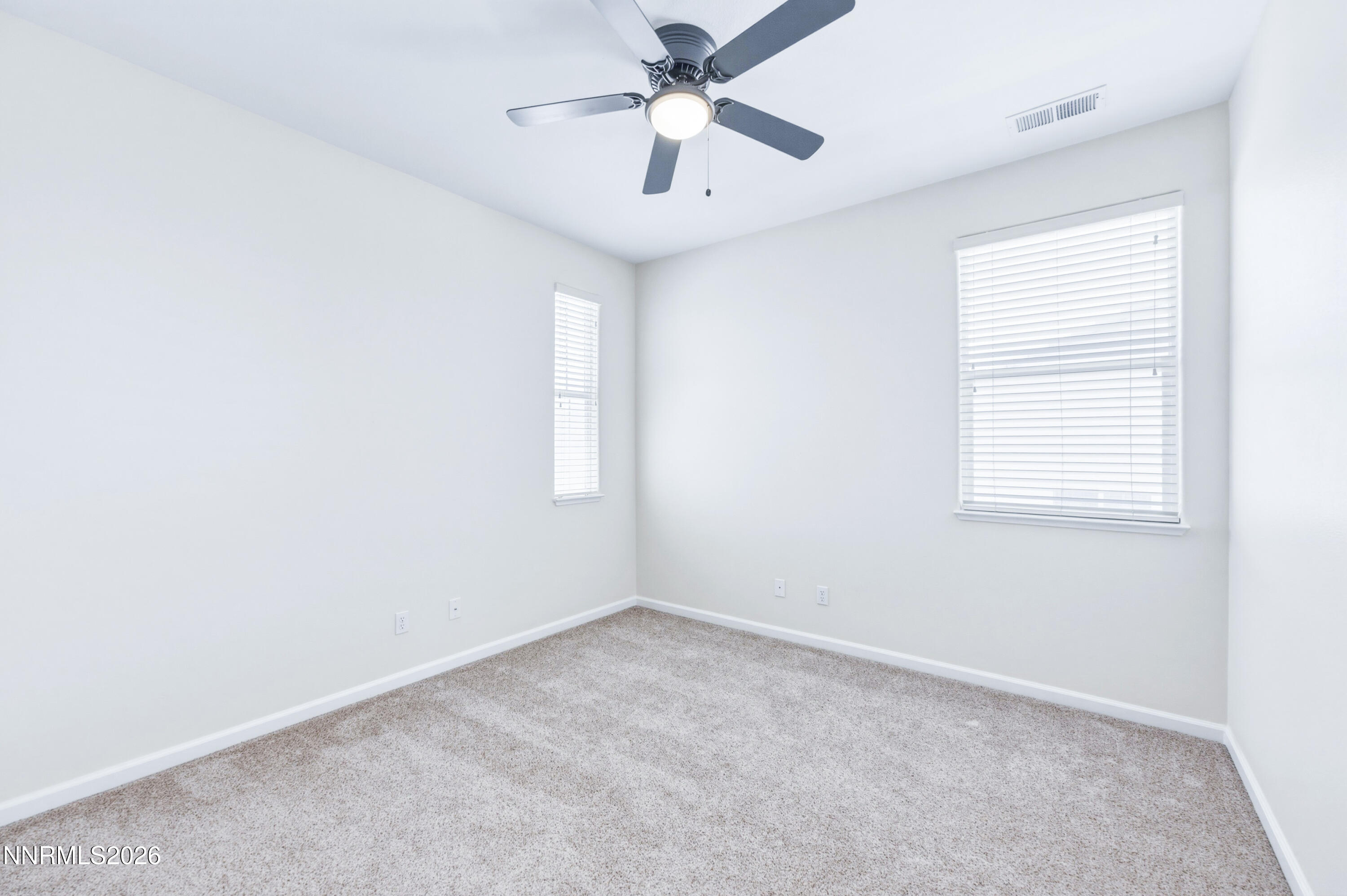 1770 Kodiak Circle Reno, NV 89511 - Photo 21 of 32 an empty room with a window and a ceiling fan