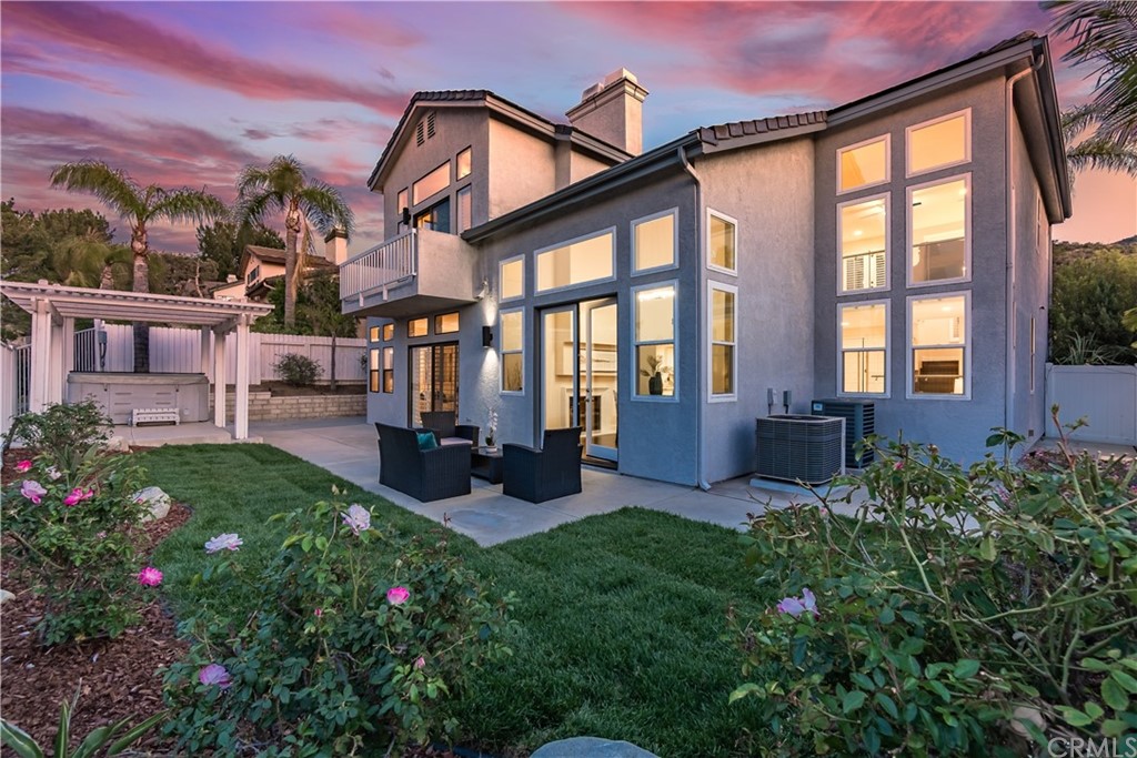 3171 Diamond View Street Corona, CA 92882 - Photo 19 of 59 a view of a house with backyard sitting area and garden