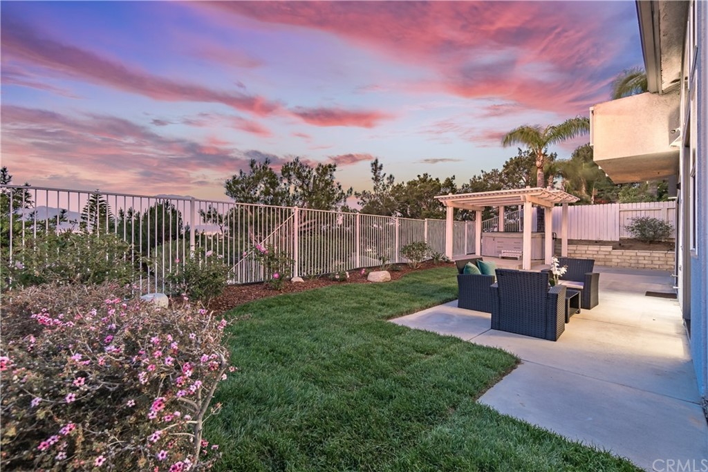 3171 Diamond View Street Corona, CA 92882 - Photo 23 of 59 a view of a garden with a building in the background