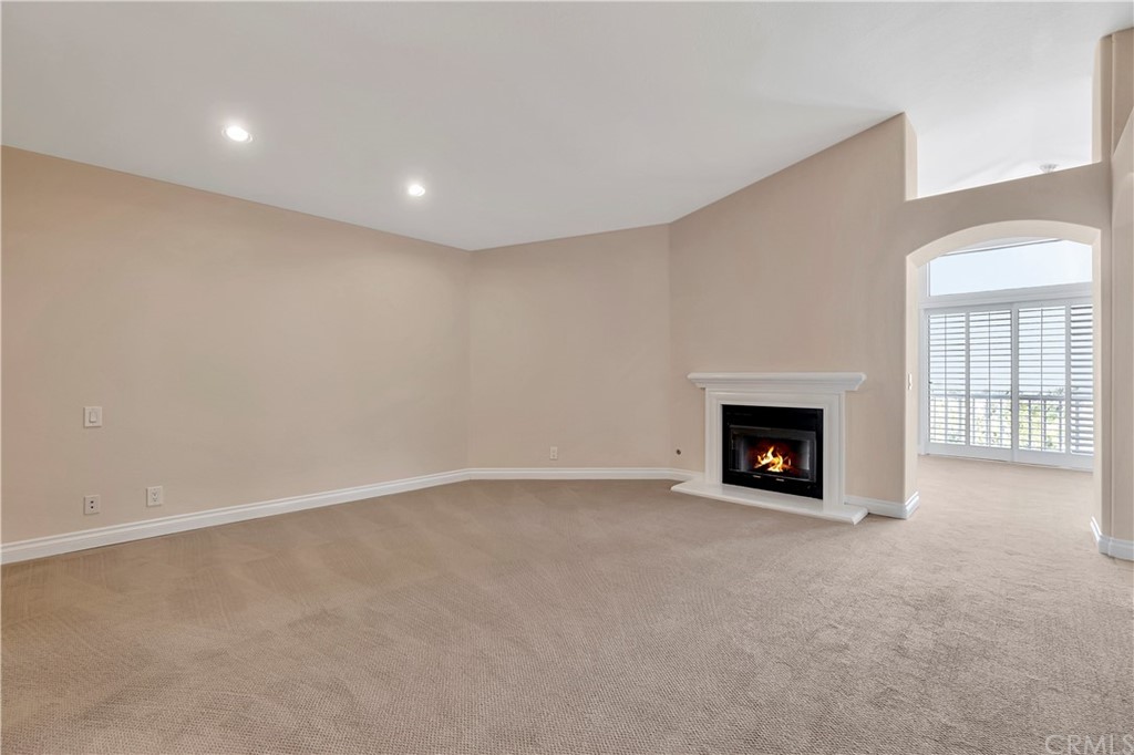 3171 Diamond View Street Corona, CA 92882 - Photo 28 of 59 a view of an empty room with a fireplace