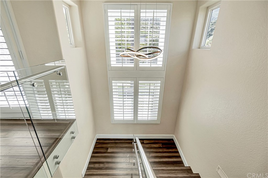3171 Diamond View Street Corona, CA 92882 - Photo 57 of 59 a view of an empty room with wooden floor and a window