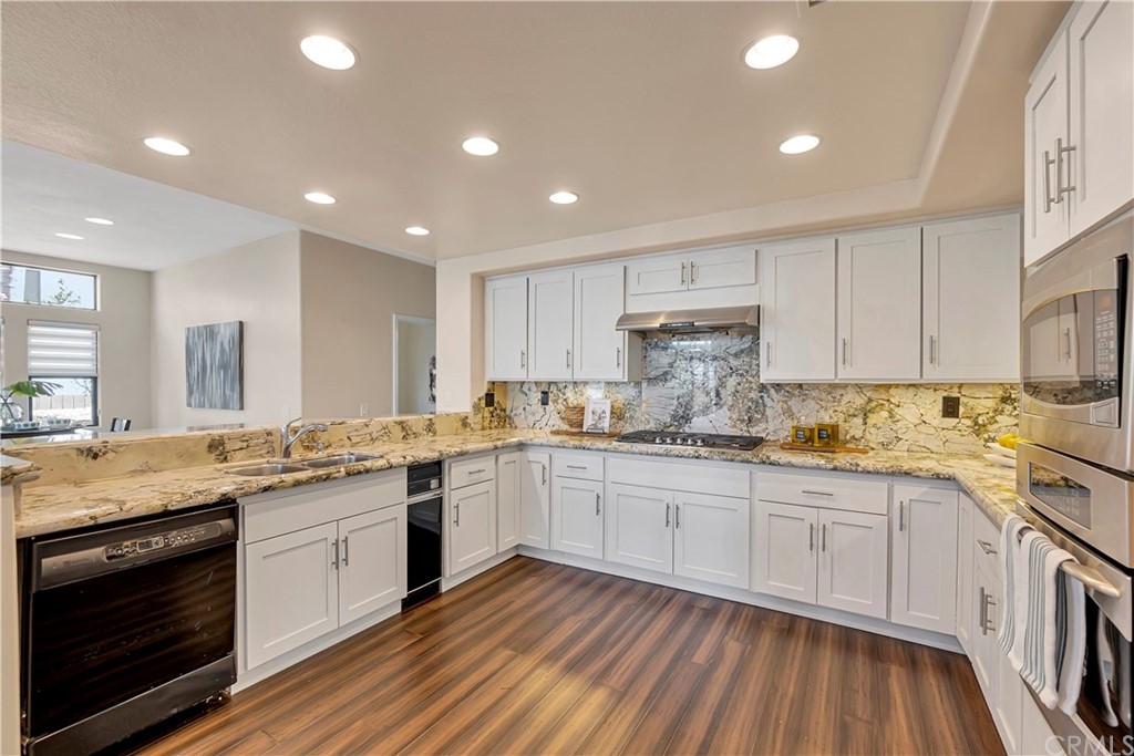 3171 Diamond View Street Corona, CA 92882 - Photo 58 of 59 a kitchen with sink stove and cabinets