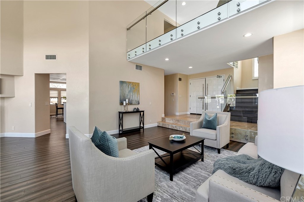 3171 Diamond View Street Corona, CA 92882 - Photo 6 of 59 a living room with furniture kitchen view and a wooden floor