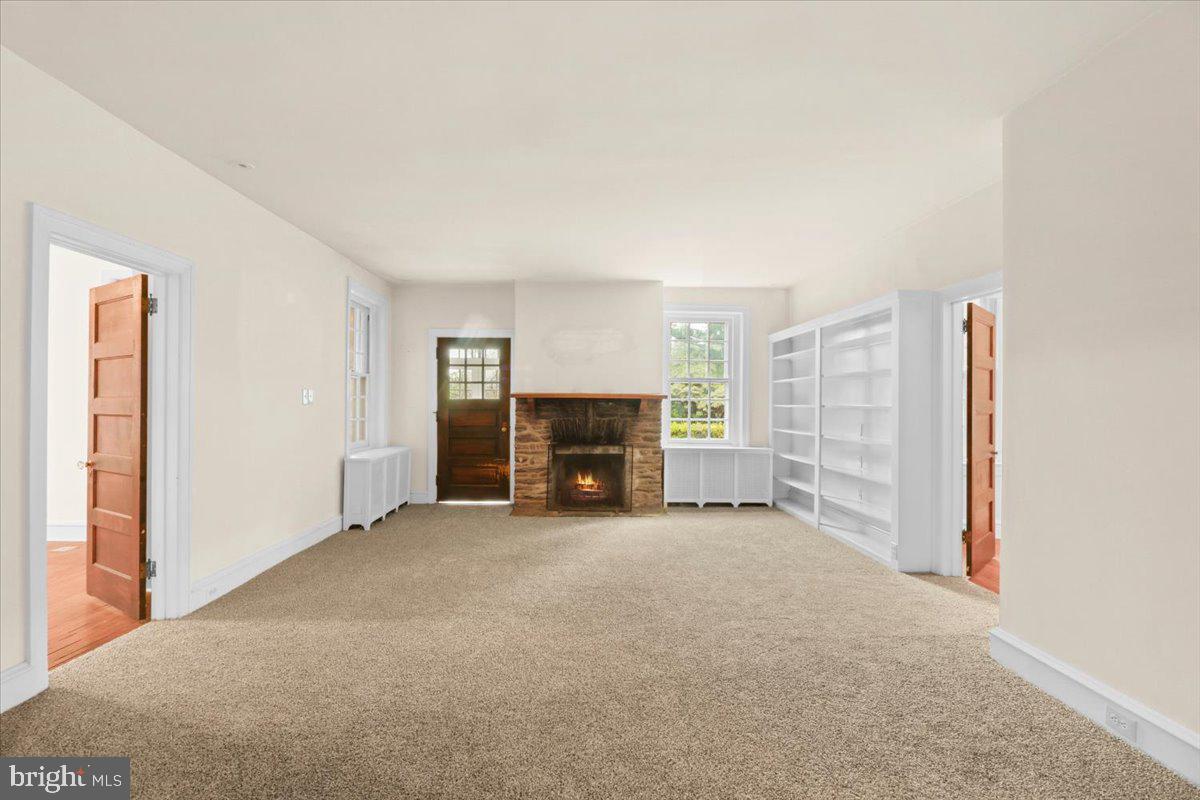 317 Waterloo Avenue Berwyn, PA 19312 - Photo 6 of 28 Great room with stone gas fireplace