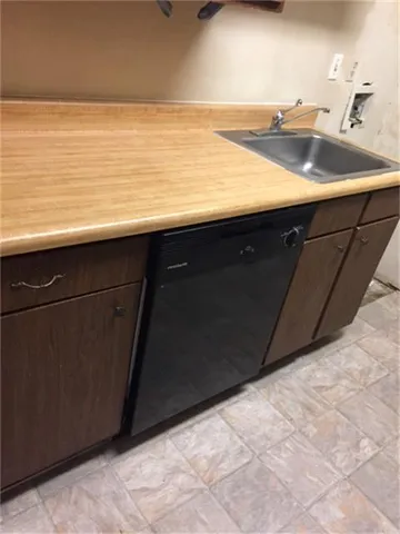 a bathroom with a sink a toilet and bathtub