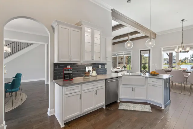 a kitchen with sink cabinets and wooden floor