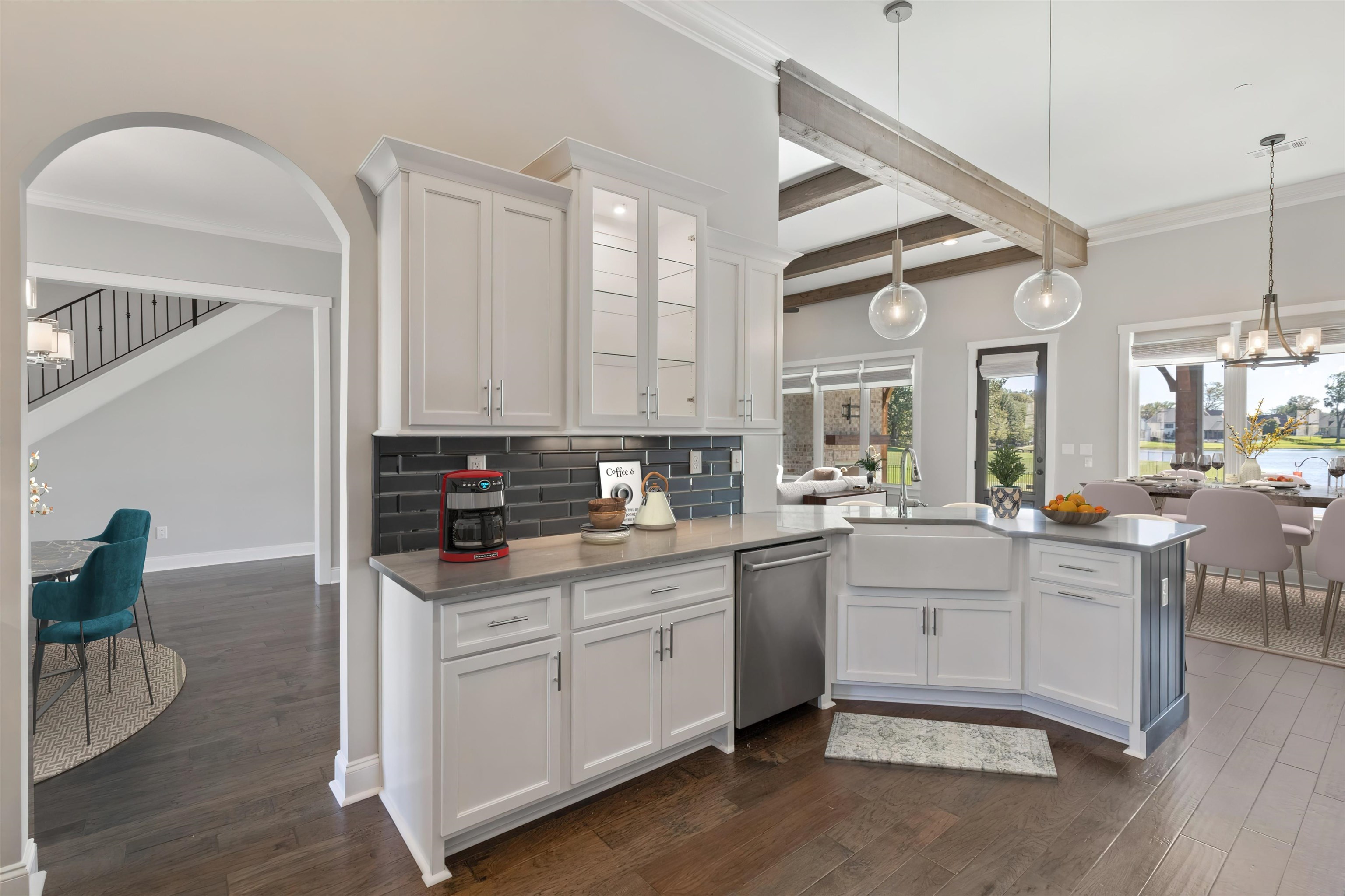 680 Magnolia Lane Piperton, TN 38017 - Photo 11 of 40 a kitchen with sink cabinets and wooden floor
