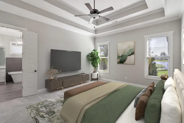 a bedroom with a large bed and a flat screen tv