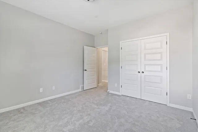 an empty room with closet area