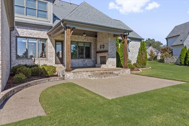 a front view of a house with garden