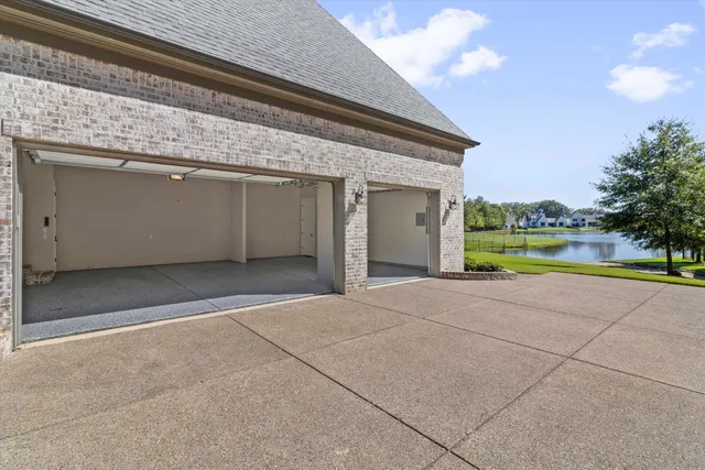 a view of a house with a yard and swimming pool