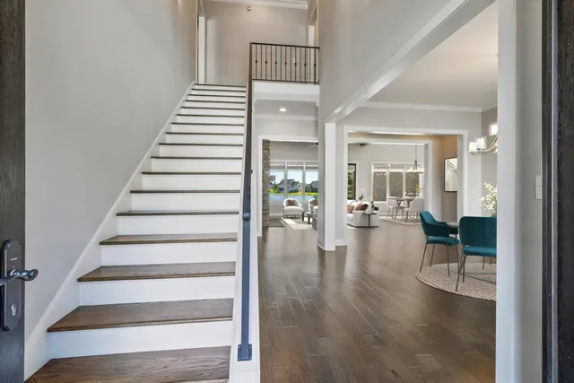 a view of entryway and hall with wooden floor