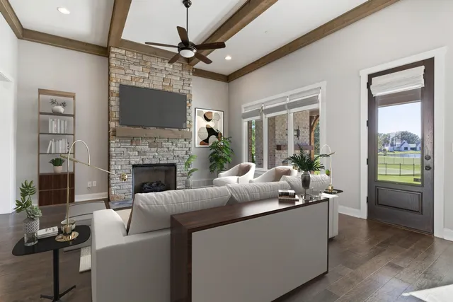 a living room with furniture and a fireplace