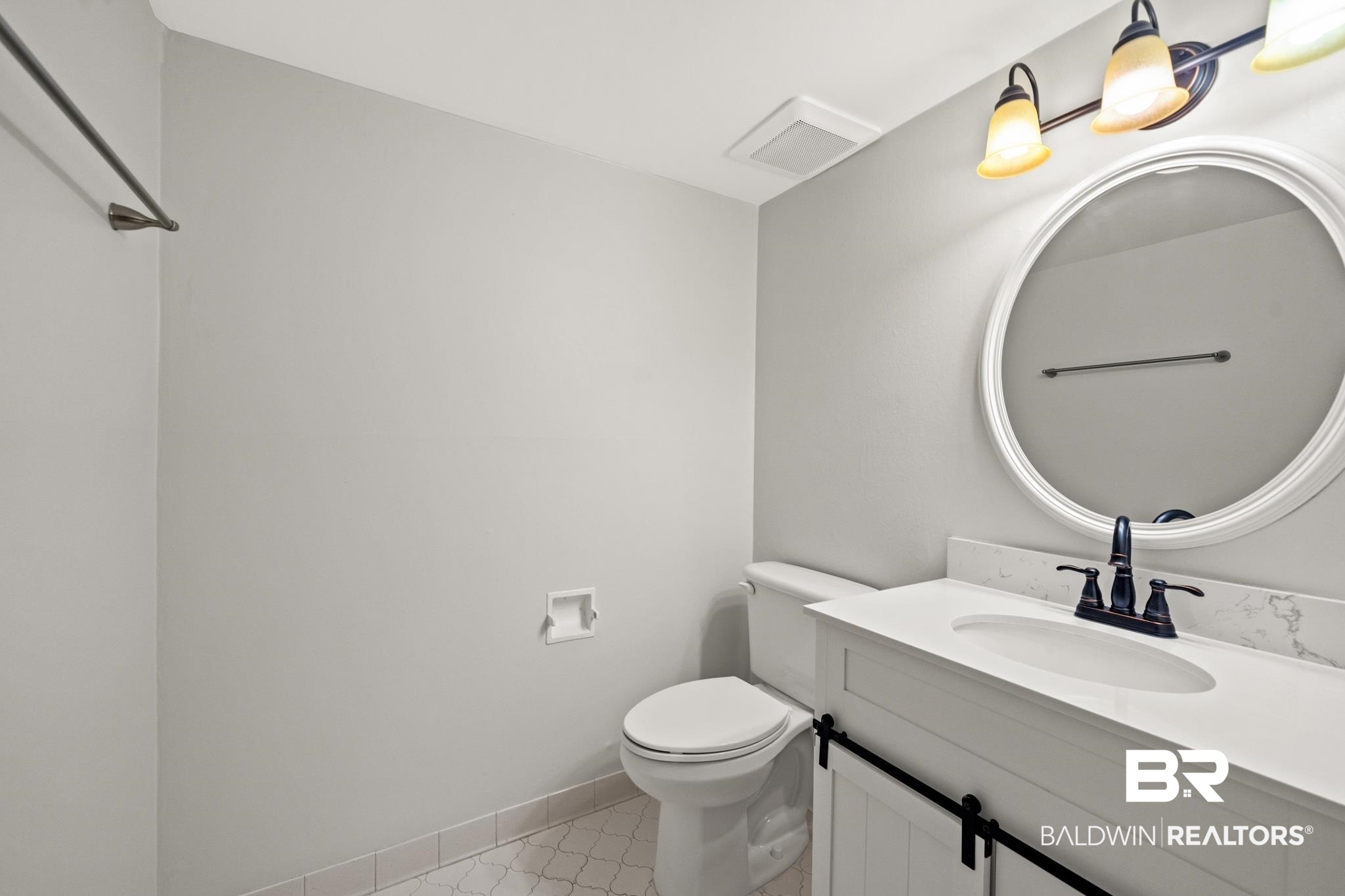 2901 Grant Street, Unit 802 Mobile, AL 36606 - Photo 10 of 37 Bathroom with tile patterned floors, toilet, and vanity