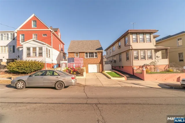 a car parked in front of a houses