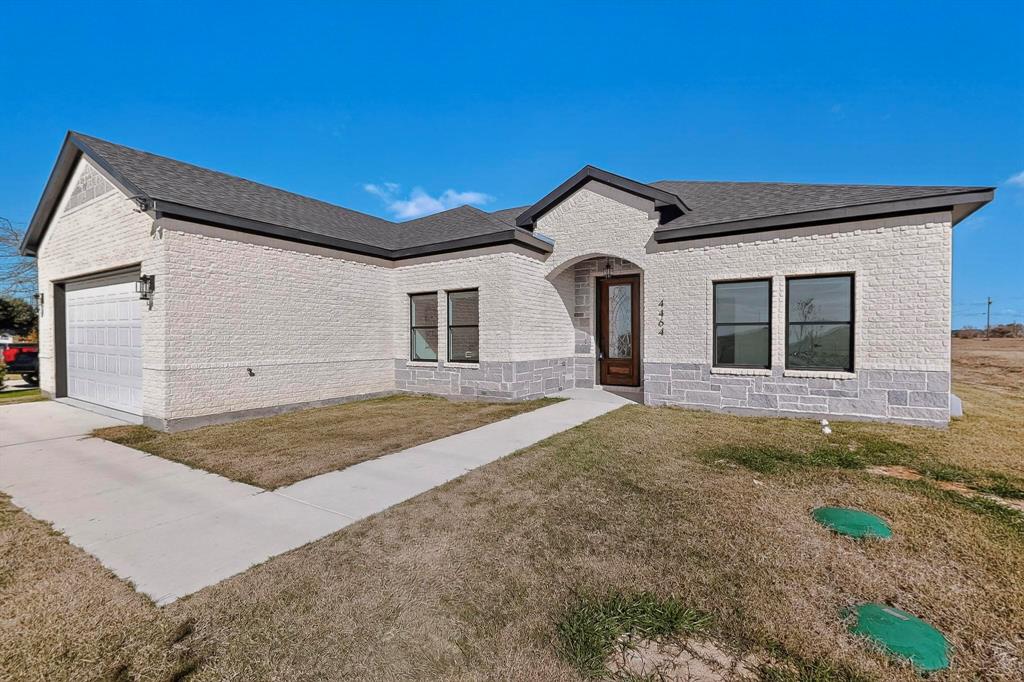 4464 Key Ranch Road Trinidad, TX 75163 - Photo 6 of 40 View of front of property featuring a front lawn, brick siding, a garage, and roof with shingles