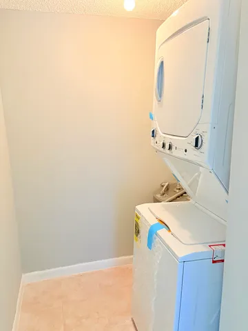 a view of a swimming pool with outdoor seating