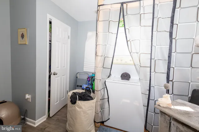 a bathroom with a sink and mirror with toilet