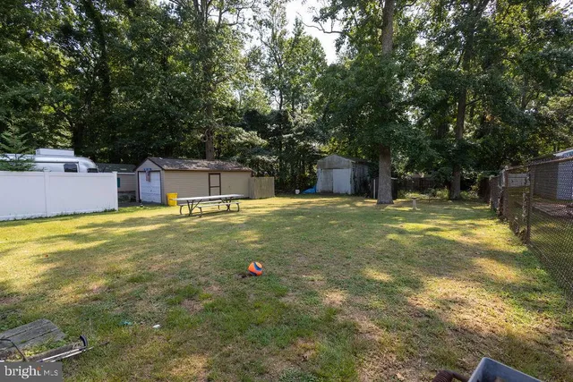 a swimming pool with trees in the background