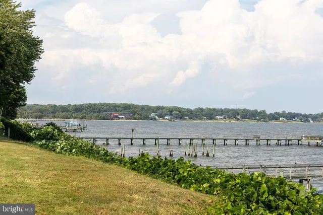 a view of a lake with houses in the back