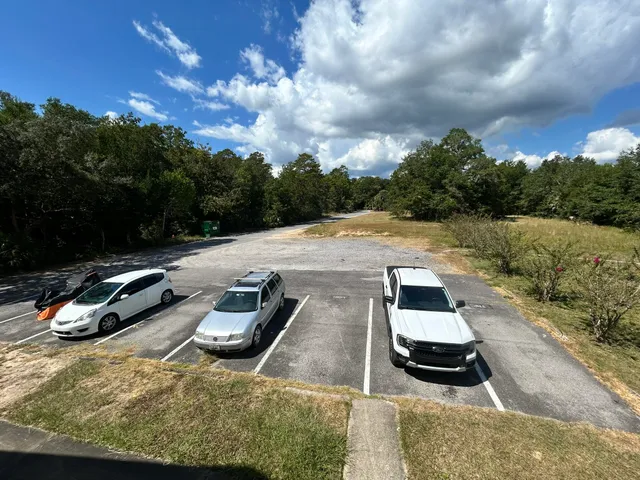 a view of a swimming pool with lawn chairs