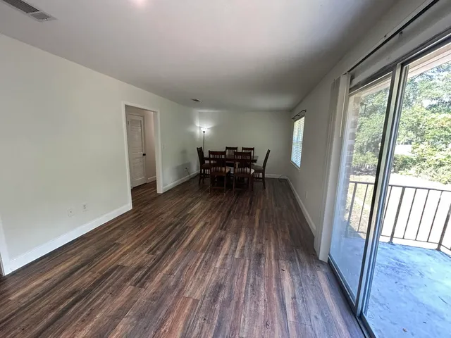 a view of dining room and wooden floor