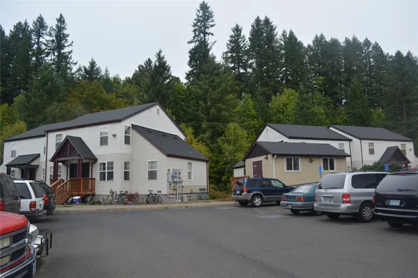 a view of a car park in front of house