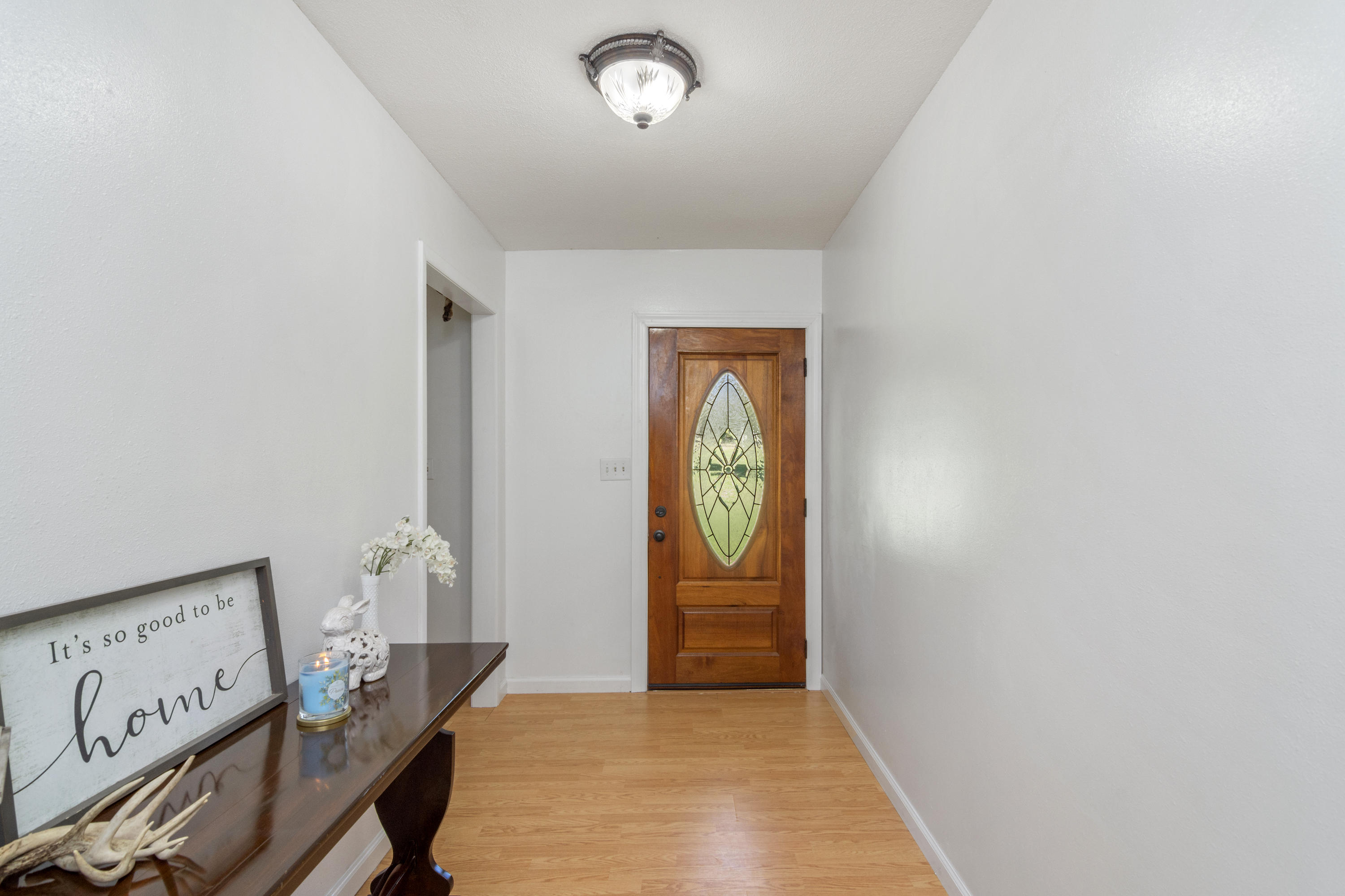 1606 Boy Scout Road DeFuniak Springs, FL 32435 - Photo 12 of 33 wooden floor in a hall with an entryway