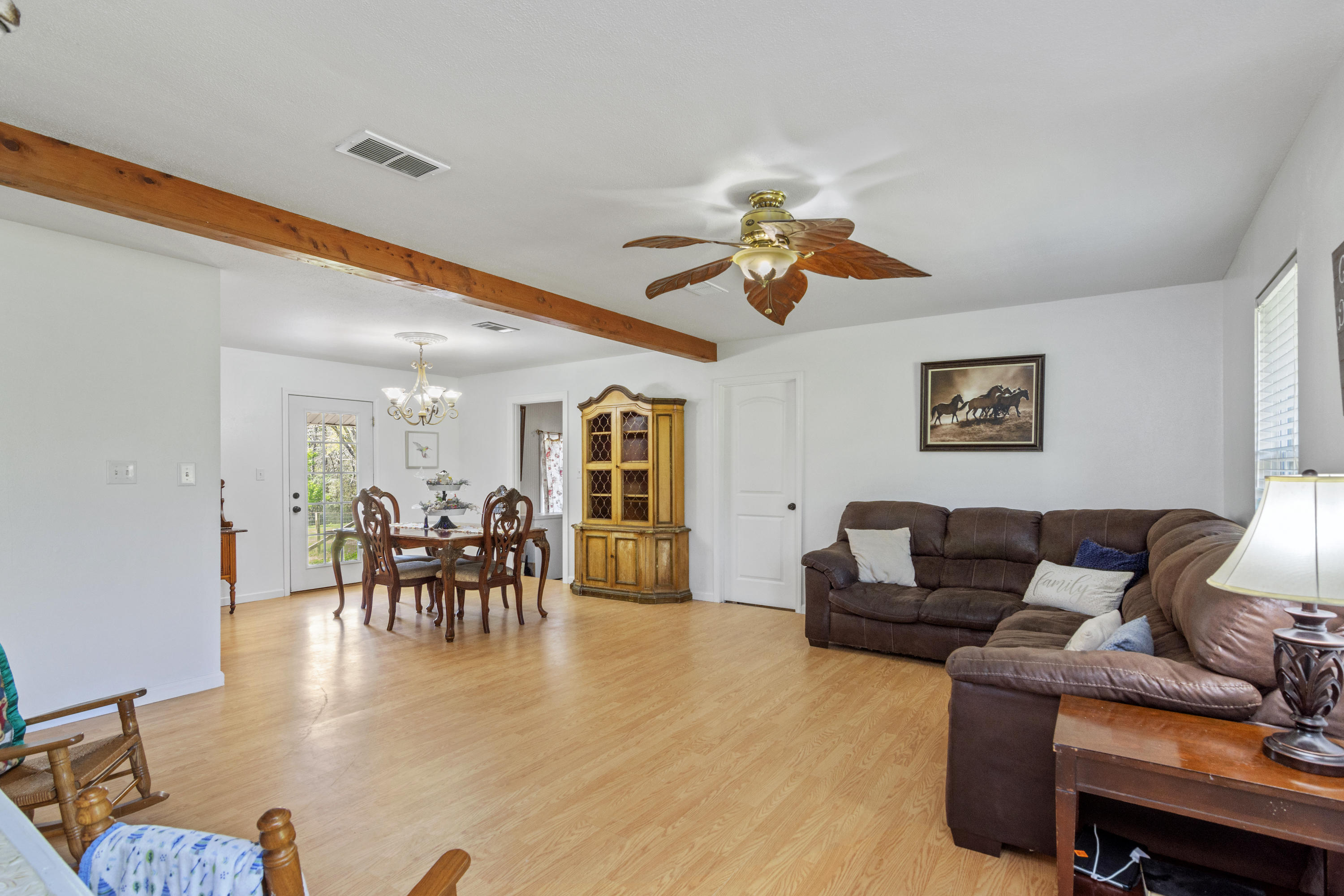 1606 Boy Scout Road DeFuniak Springs, FL 32435 - Photo 14 of 33 a living room with furniture kitchen view and a dining table