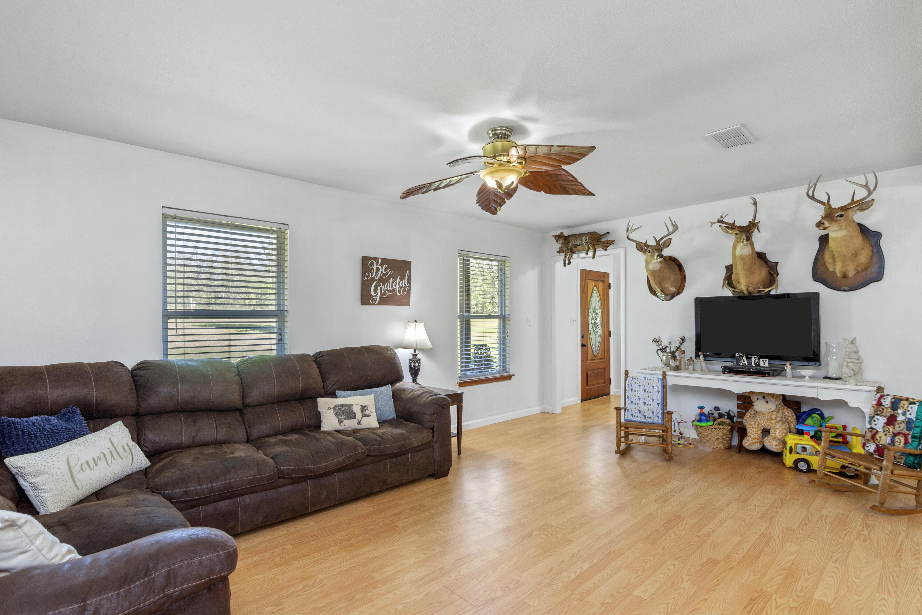 1606 Boy Scout Road DeFuniak Springs, FL 32435 - Photo 16 of 33 a living room with furniture and a flat screen tv