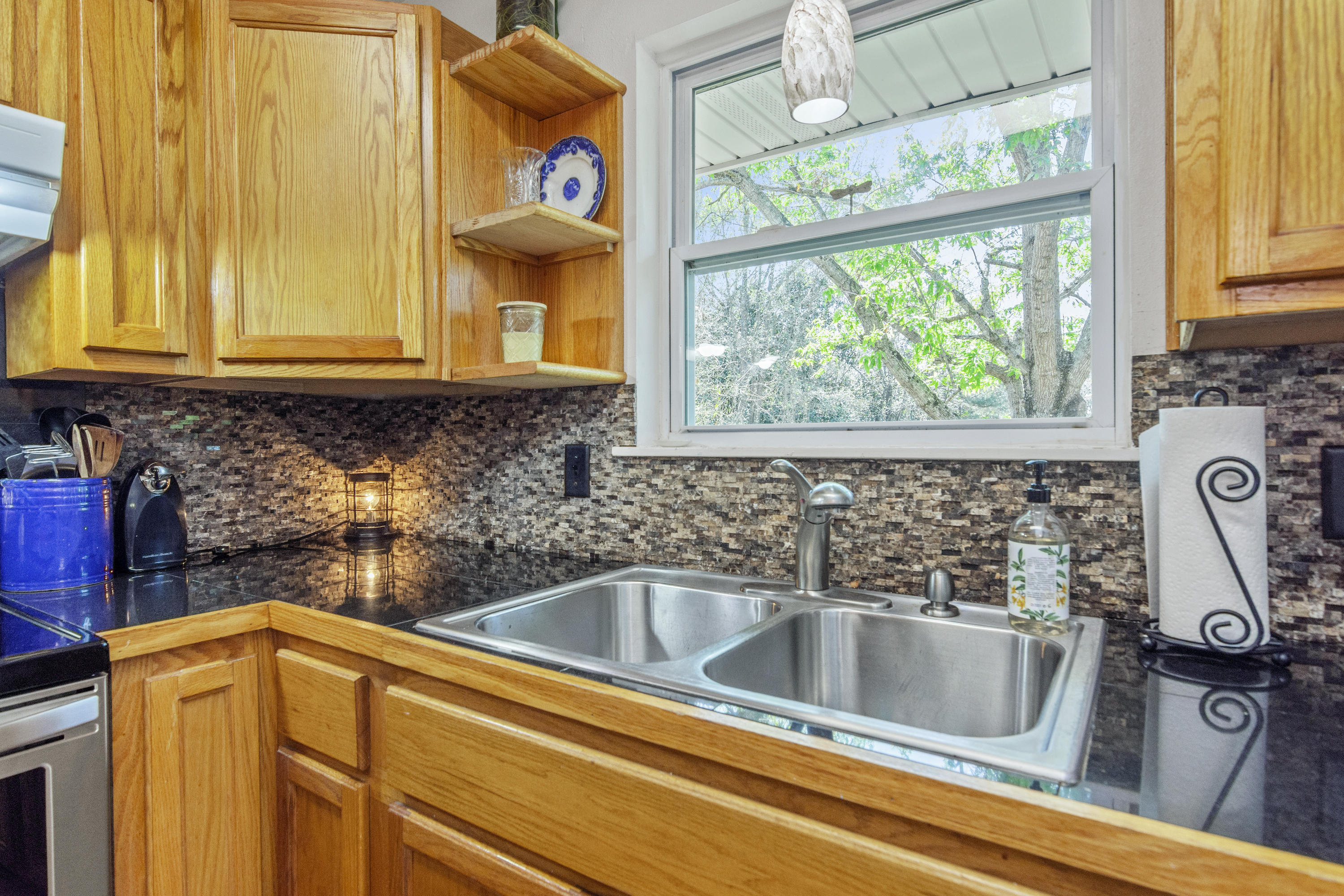 1606 Boy Scout Road DeFuniak Springs, FL 32435 - Photo 21 of 33 a kitchen with a sink and a window