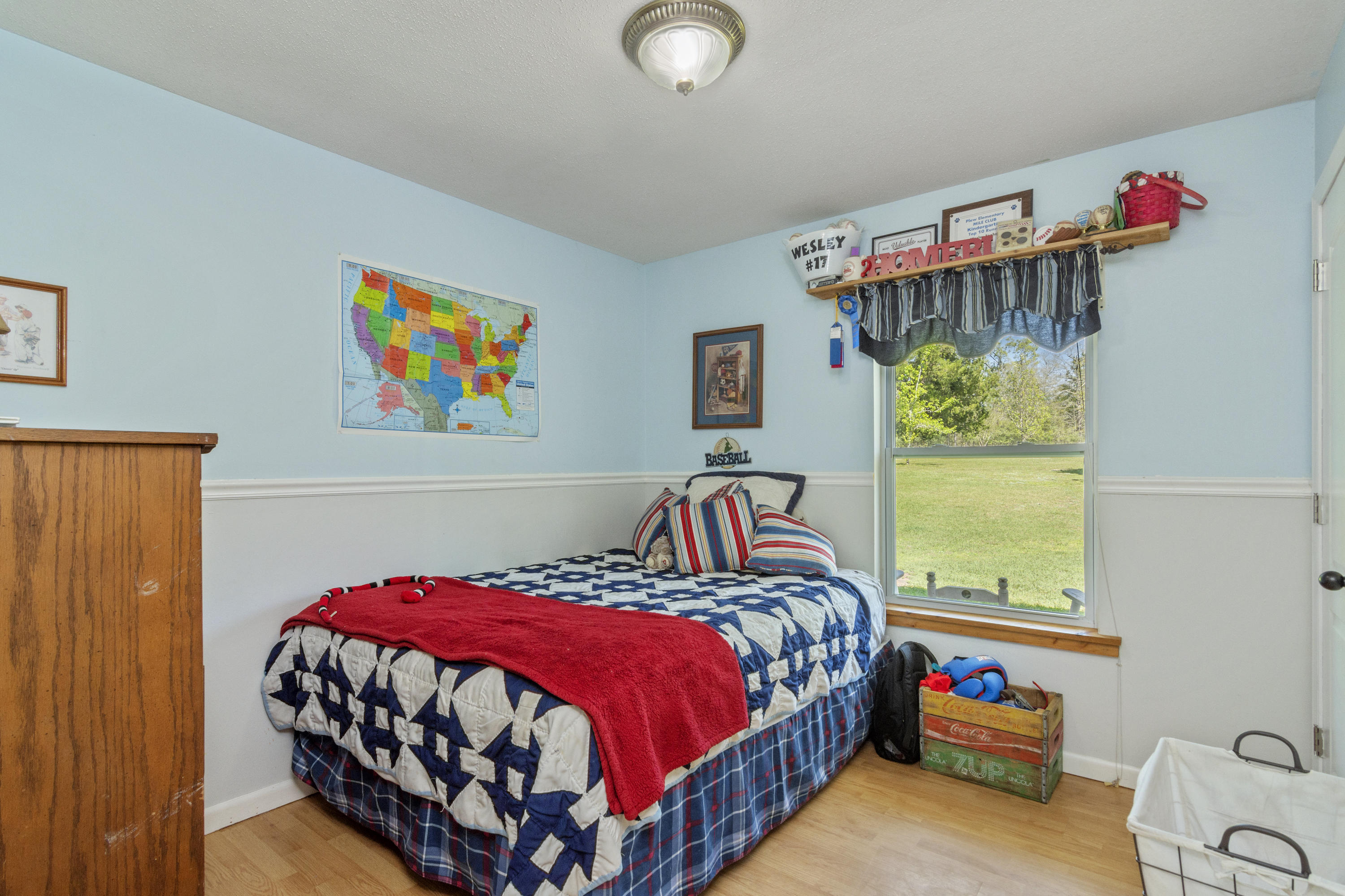 1606 Boy Scout Road DeFuniak Springs, FL 32435 - Photo 22 of 33 a bedroom with a bed and a window