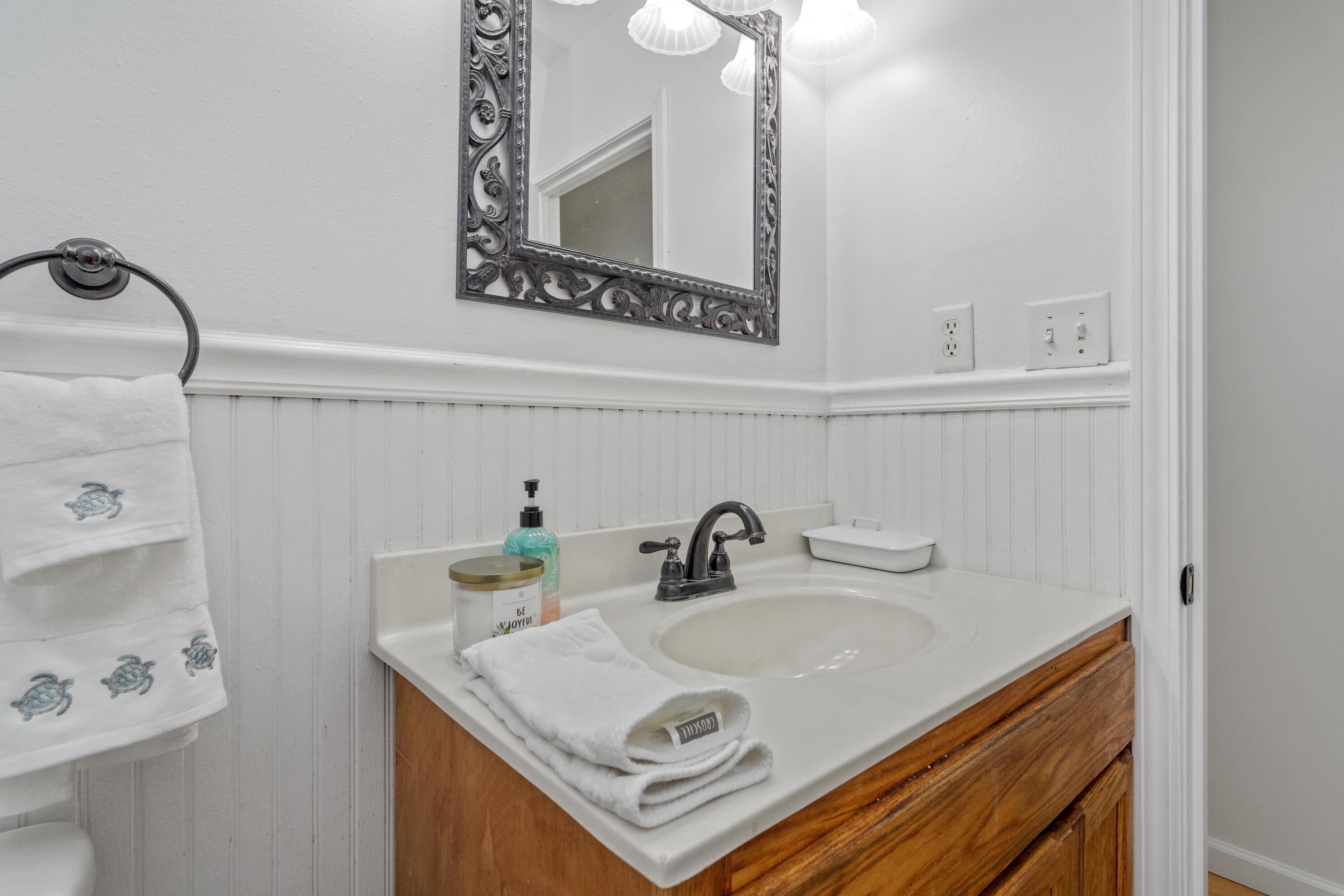 1606 Boy Scout Road DeFuniak Springs, FL 32435 - Photo 31 of 33 a bathroom with a sink and a mirror